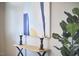 Hallway boasts a table with black accents, decor, abstract wall art, and a fig plant at 1112 Addington Lake Ln, Knightdale, NC 27545