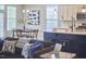 Open concept kitchen with white cabinets and adjacent dining area at 1112 Addington Lake Ln, Knightdale, NC 27545