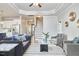 Spacious living room showcasing an open floor plan with a staircase and ample seating at 1112 Addington Lake Ln, Knightdale, NC 27545
