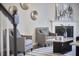 Cozy living room with two chairs, modern fireplace, and striped rug at 1112 Addington Lake Ln, Knightdale, NC 27545