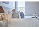 A decorated bed in the main bedroom with side table at 1112 Addington Lake Ln, Knightdale, NC 27545