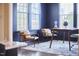 Home office with navy walls and a desk and chair at 1112 Addington Lake Ln, Knightdale, NC 27545