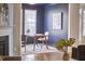Home office with navy walls and desk with seating at 1112 Addington Lake Ln, Knightdale, NC 27545