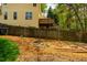 Private backyard featuring a wooded area, raised garden beds, and space for outdoor enjoyment at 113 Glenmore Rd, Chapel Hill, NC 27516