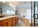 Spacious bathroom offers double vanity, large soaking tub, and glass shower enclosure at 113 Glenmore Rd, Chapel Hill, NC 27516