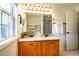 Bathroom featuring a double vanity with granite countertops and a built-in cabinet for storage at 113 Glenmore Rd, Chapel Hill, NC 27516