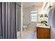 Cozy bathroom featuring a tiled shower and a double sink vanity with granite countertops at 113 Glenmore Rd, Chapel Hill, NC 27516