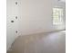 Neutral bedroom with light walls, plush carpeting, and a window offering natural light at 113 Glenmore Rd, Chapel Hill, NC 27516