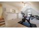 Bright bonus room with exercise bike, fitness equipment, and built in storage at 113 Glenmore Rd, Chapel Hill, NC 27516