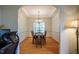 Formal dining room featuring hardwood floors, a modern chandelier, and tray ceilings at 113 Glenmore Rd, Chapel Hill, NC 27516