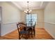 Traditional dining room with wainscoting, hardwood floors, and coffered ceiling at 113 Glenmore Rd, Chapel Hill, NC 27516