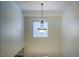 High-ceiling foyer with decorative chandelier and window, showcasing the home's grand entrance at 113 Glenmore Rd, Chapel Hill, NC 27516
