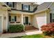Charming home's front entrance with well-maintained landscaping and a cozy, inviting entryway at 113 Glenmore Rd, Chapel Hill, NC 27516