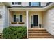 Charming front porch with brick steps, potted flowers, and classic exterior shutters at 113 Glenmore Rd, Chapel Hill, NC 27516