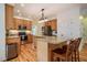 Open kitchen boasts stainless steel appliances, custom cabinets, and a spacious center island at 113 Glenmore Rd, Chapel Hill, NC 27516