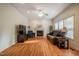 Bright living room features hardwood floors, fireplace, and plenty of natural light at 113 Glenmore Rd, Chapel Hill, NC 27516