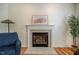 Cozy living room features a fireplace with mantel and tiled surround at 113 Glenmore Rd, Chapel Hill, NC 27516