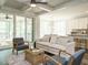 Open living space featuring an adjoining kitchen, dining area and access to the porch at 113 Tower Ridge Ln, Sanford, NC 27330