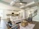Open living space featuring a ceiling fan, modern furniture, hardwood floors and a kitchen at 113 Tower Ridge Ln, Sanford, NC 27330