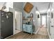 Hallway with decor connects kitchen and laundry room at 114 Carriage Hill Dr, Stem, NC 27581