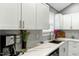 Modern kitchen with granite countertops, stainless steel appliances, and sleek cabinetry at 114 Carriage Hill Dr, Stem, NC 27581