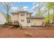 Backyard view with deck, patio, and well-maintained landscaping around the house at 120 Cypress View Way, Apex, NC 27502