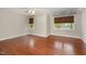 Bright bedroom with hardwood floors and three windows at 120 Cypress View Way, Apex, NC 27502