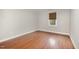 Light-filled bedroom with hardwood floors and neutral paint at 120 Cypress View Way, Apex, NC 27502