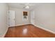 Cozy bedroom with hardwood floors, a ceiling fan, and natural light at 120 Cypress View Way, Apex, NC 27502