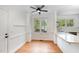Cozy breakfast nook bathed in natural light, featuring hardwood floors and views of the outdoors at 120 Cypress View Way, Apex, NC 27502