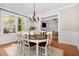 Elegant dining room with hardwood floors, chandelier, and view into the living room at 120 Cypress View Way, Apex, NC 27502