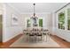 Elegant dining room with hardwood floors, chandelier, and view to exterior at 120 Cypress View Way, Apex, NC 27502