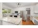 Modern kitchen with stainless steel appliances, granite countertops, and ample cabinet space at 120 Cypress View Way, Apex, NC 27502