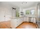 Modern kitchen with stainless steel appliances, granite countertops, and ample cabinet space at 120 Cypress View Way, Apex, NC 27502