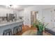 Bright, open kitchen features a large island with seating, modern lighting, and a view into other rooms at 120 Cypress View Way, Apex, NC 27502