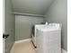 Well-lit laundry room equipped with washer and dryer at 120 Cypress View Way, Apex, NC 27502