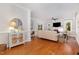 Spacious living room with hardwood floors, fireplace, and lots of natural light at 120 Cypress View Way, Apex, NC 27502