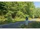 Scenic walking path amidst lush greenery, promoting an active lifestyle and outdoor enjoyment at 120 Cypress View Way, Apex, NC 27502