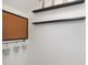 Creative wall decor featuring open shelves and metal buckets at 120 Cypress View Way, Apex, NC 27502