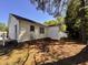 Side yard features vinyl siding and a utility building in a sunny backyard at 1204 Amberstone Dr, Knightdale, NC 27545