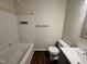 Bathroom featuring modern fixtures, a sleek vanity, and a shower-tub combo at 1204 Amberstone Dr, Knightdale, NC 27545