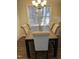 Dining room area featuring a wooden table with six upholstered chairs at 1204 Amberstone Dr, Knightdale, NC 27545