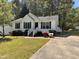 Inviting home with colorful landscaping and a paved driveway at 1204 Amberstone Dr, Knightdale, NC 27545
