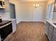 Kitchen with stainless appliances and marble backsplash open to a dining area at 1204 Amberstone Dr, Knightdale, NC 27545