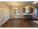 Eat-in kitchen area with view to a window over the stainless steel sink and gray cabinets at 1204 Amberstone Dr, Knightdale, NC 27545