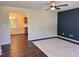 Spacious living room with wood floors that opens into the kitchen, creating a welcoming space at 1204 Amberstone Dr, Knightdale, NC 27545
