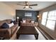 Cozy living room with comfortable sofas, a large window, and a dark accent wall at 1204 Amberstone Dr, Knightdale, NC 27545