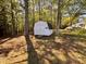 Exterior shot of a storage shed on the property surrounded by mature trees at 1204 Amberstone Dr, Knightdale, NC 27545