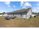 Backyard with vinyl siding, satellite dish, and covered AC units at 123 Ariel St, Lillington, NC 27546