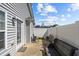 Backyard features a patio door, white fence, and outdoor seating at 123 Ariel St, Lillington, NC 27546